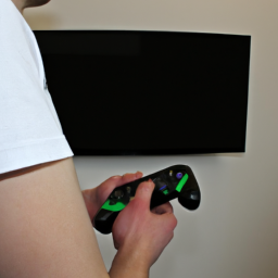 description: the image shows a person holding an xbox controller, looking at a blank tv screen with frustration. the person's face is not visible, but their body language suggests annoyance and disappointment.