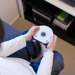 A person playing a video game on a console with a disc in the disc drive.