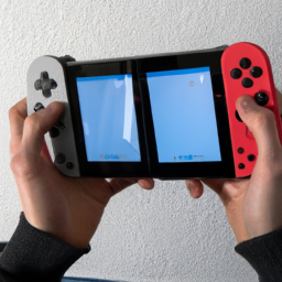 a person holding a nintendo switch console with two joy-con controllers attached. the console is in handheld mode and the person is playing a game on the screen.